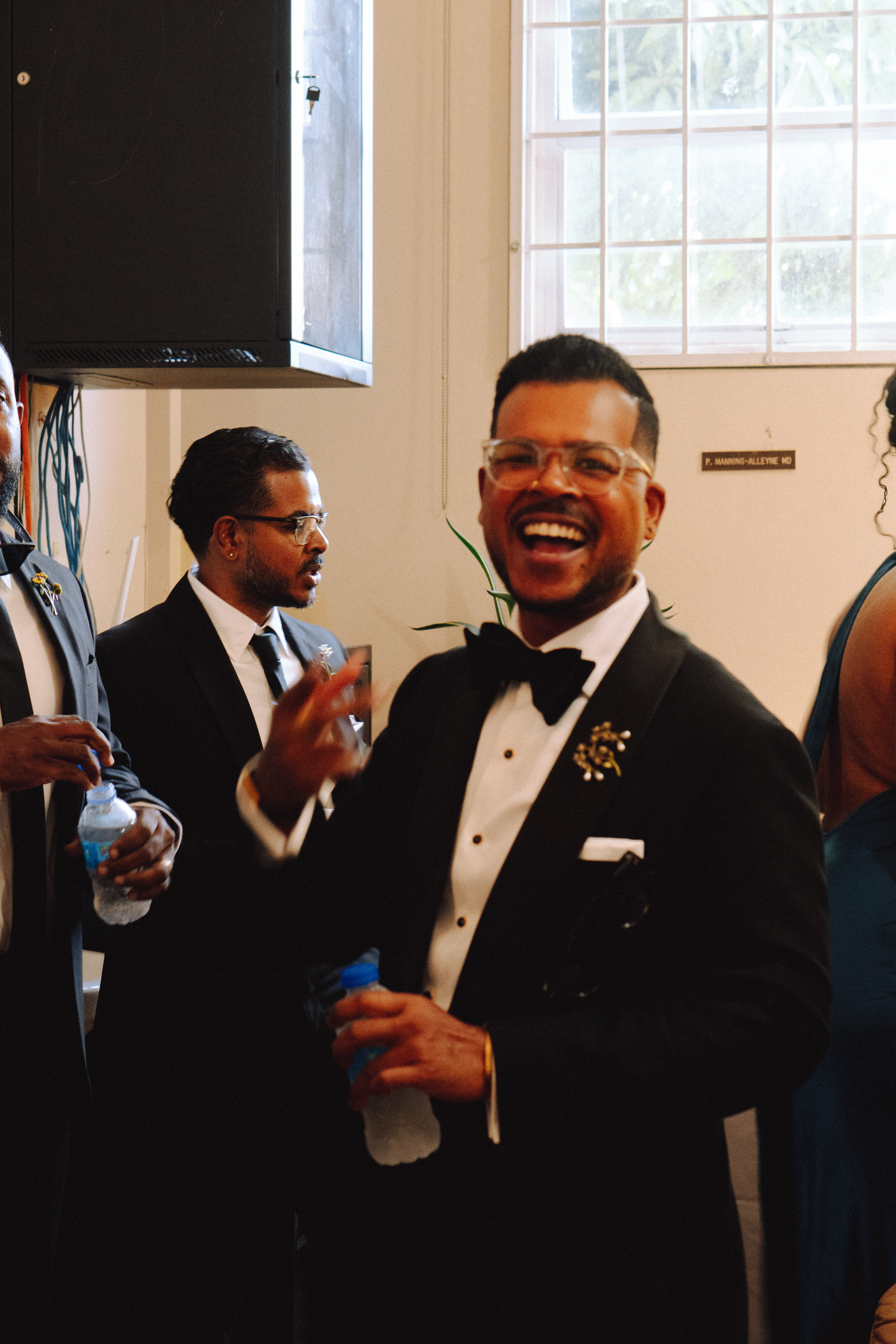 Kevin laughing with guests before the ceremony
