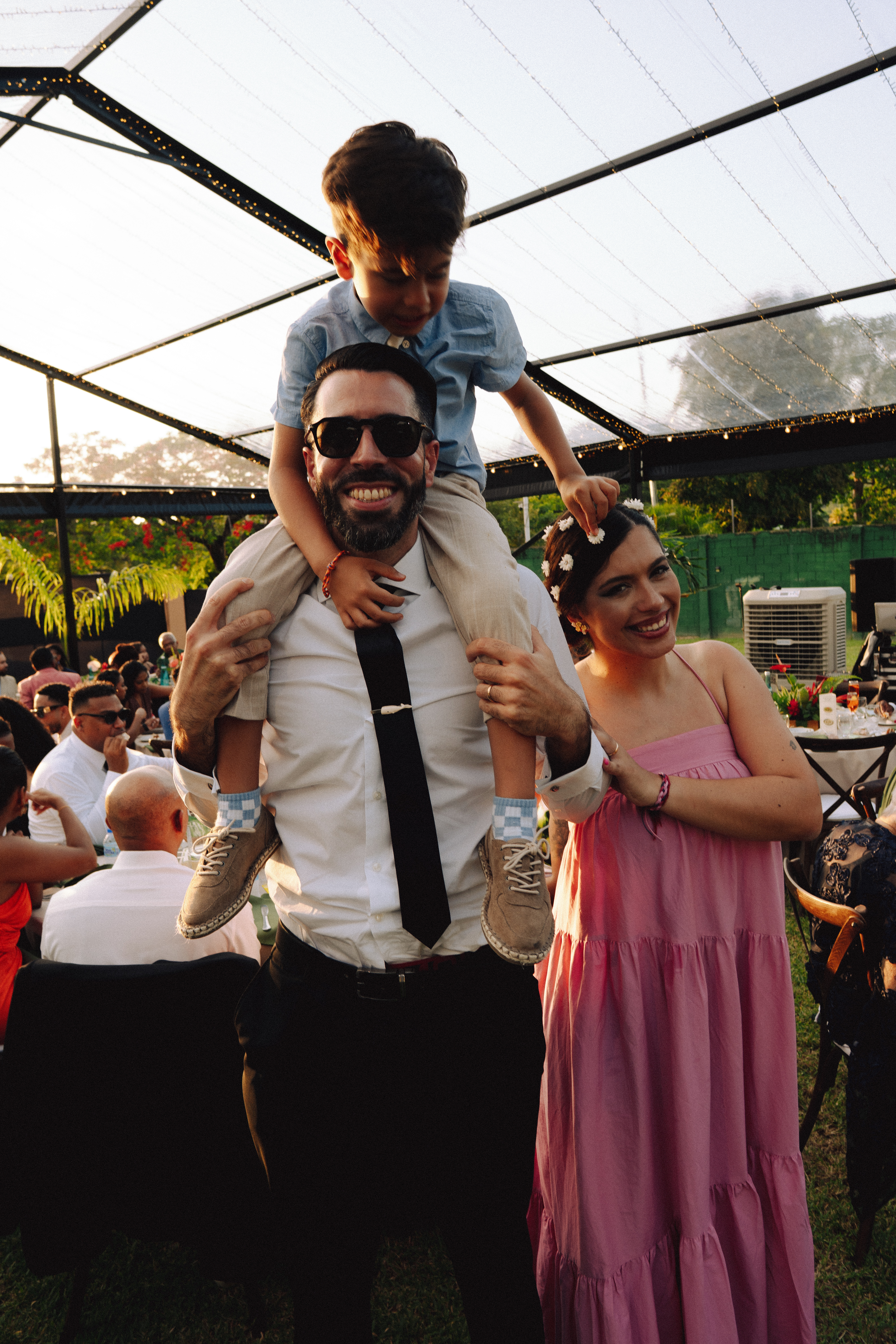 Wedding guests sharing a playful moment during the reception